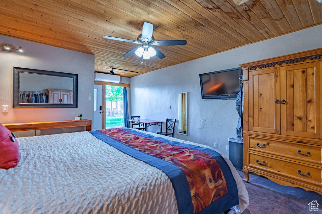 Bedroom featuring wooden ceiling, ceiling fan, and access to outside