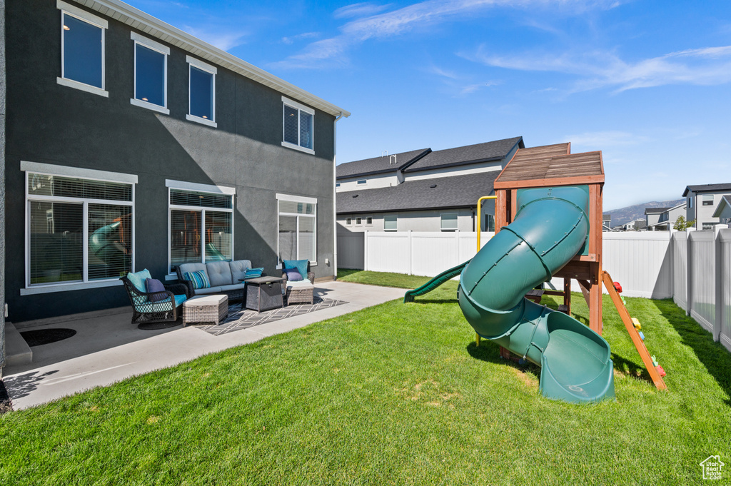 View of yard with a patio, a playground, and outdoor lounge area