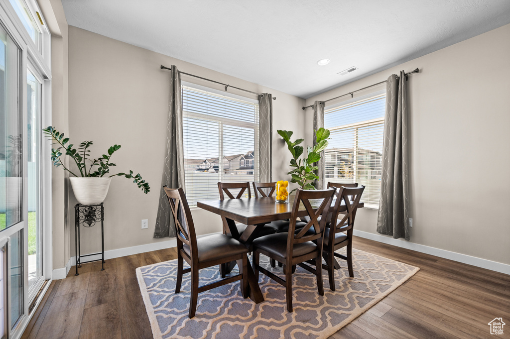 Dining space featuring dark hardwood / wood-style flooring