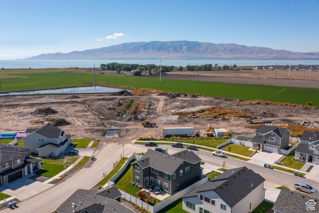 Birds eye view of property featuring a water and mountain view