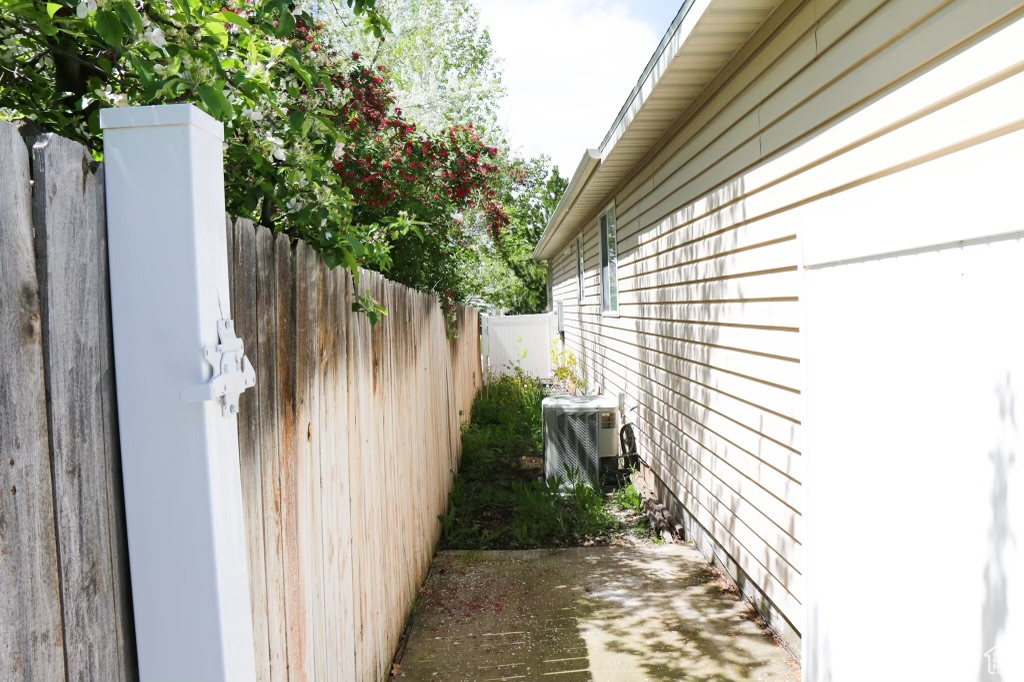 View of property exterior featuring central AC unit