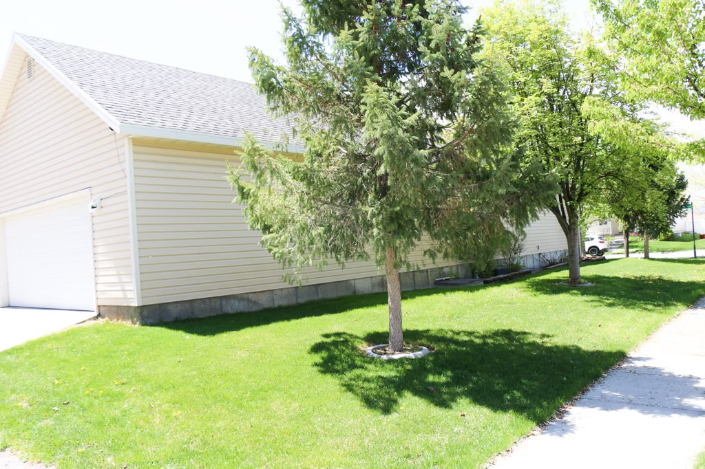 View of yard with a garage