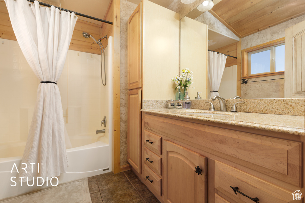 Bathroom featuring large vanity, wood ceiling, shower / bath combo, tile floors, and vaulted ceiling