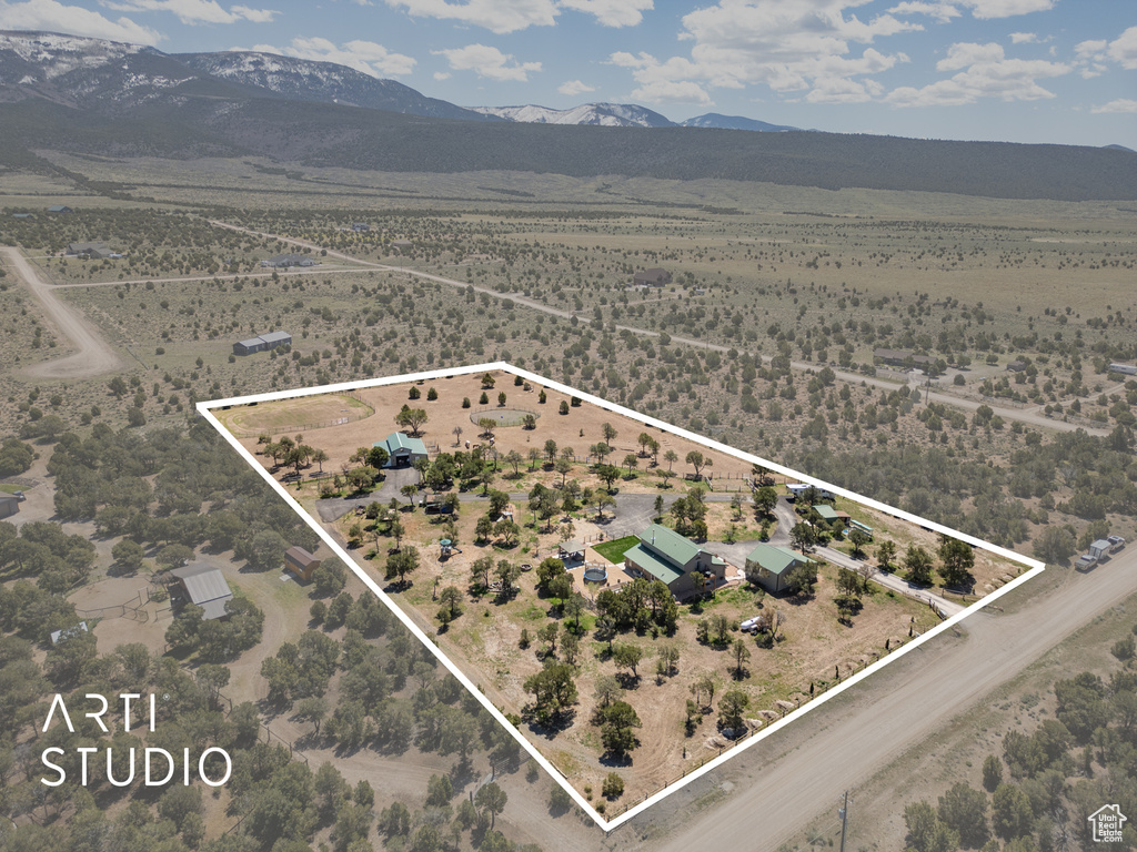 Birds eye view of property with a mountain view