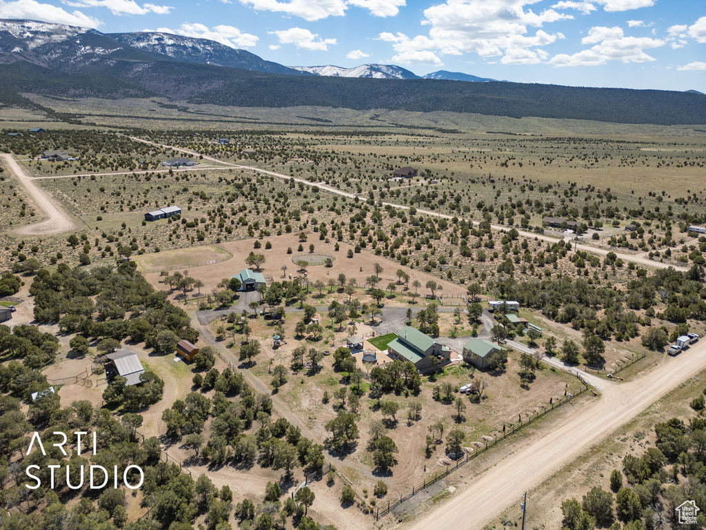 Birds eye view of property with a mountain view