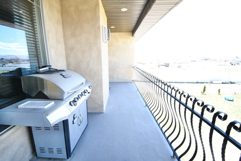 Balcony featuring area for grilling