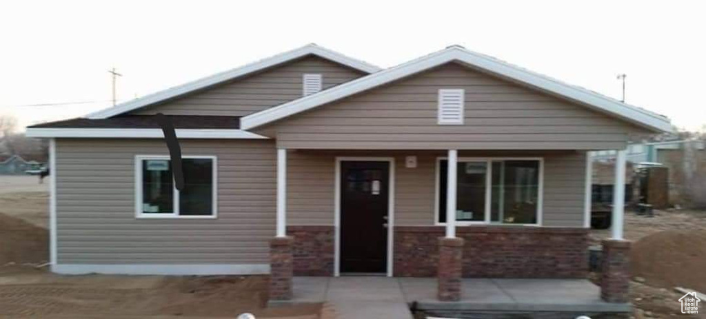 Bungalow-style house featuring a porch