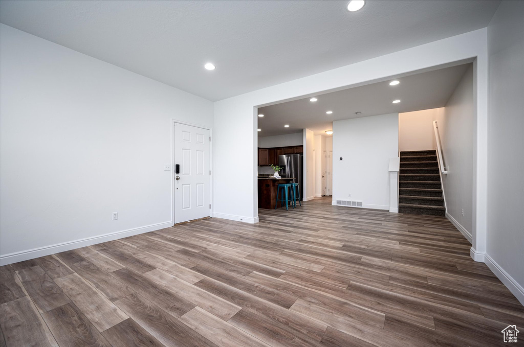 Unfurnished living room featuring hardwood / wood-style flooring