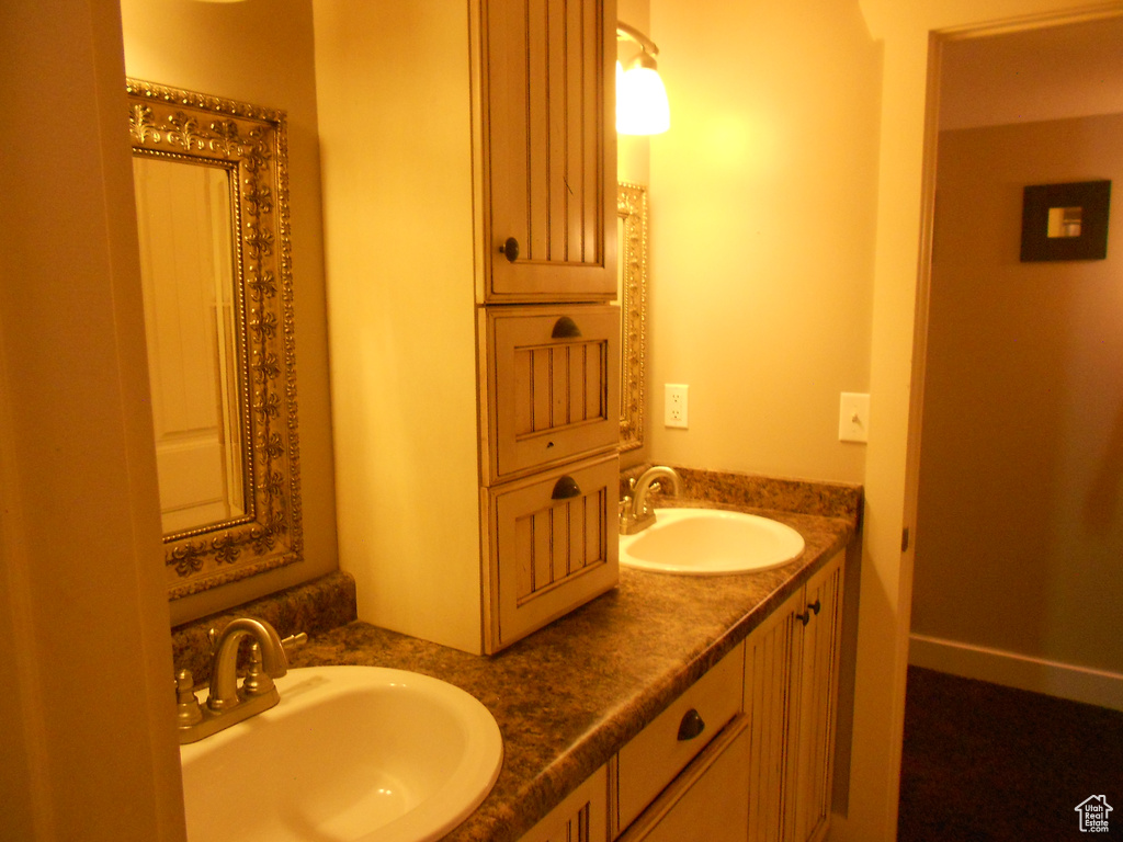 Bathroom featuring oversized vanity and double sink
