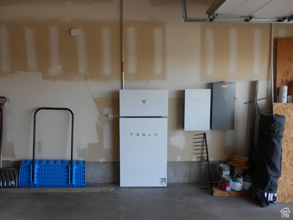 Garage with white refrigerator
