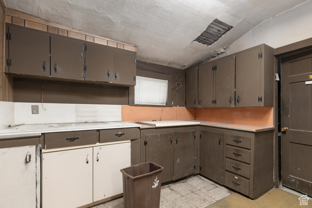 Kitchen with light tile floors