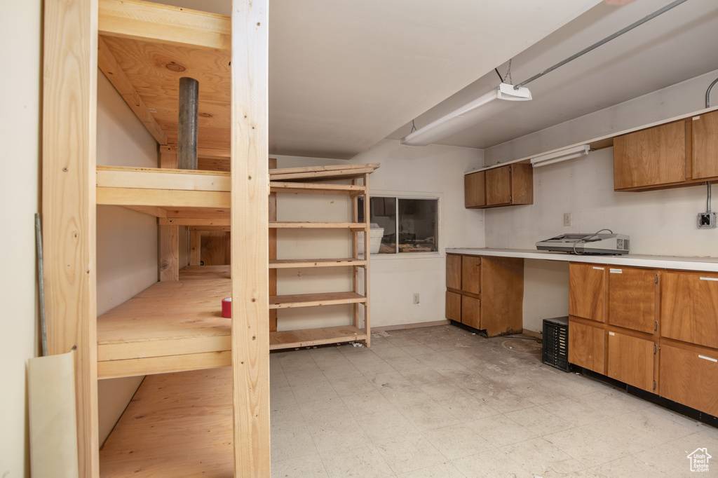 Interior space featuring light tile floors