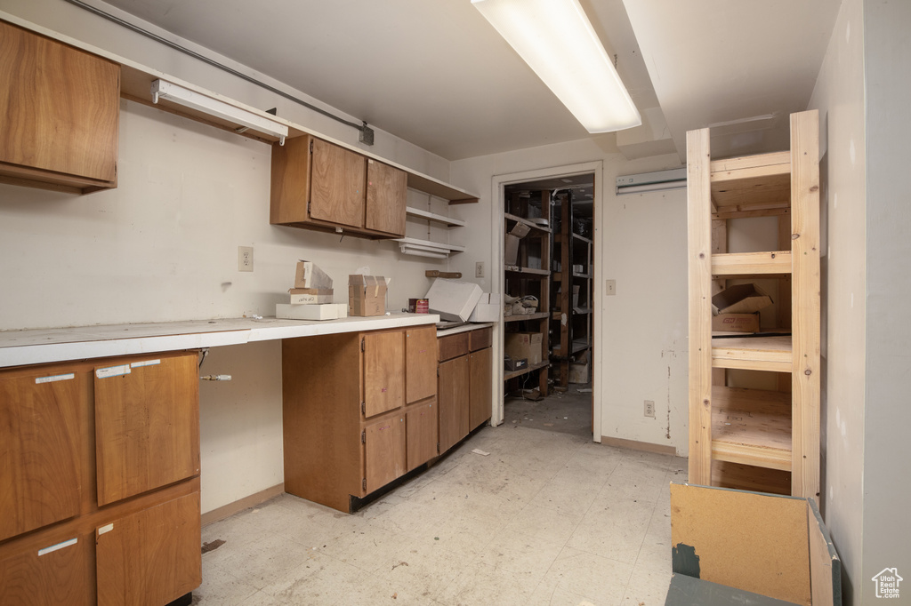 Kitchen featuring light tile flooring