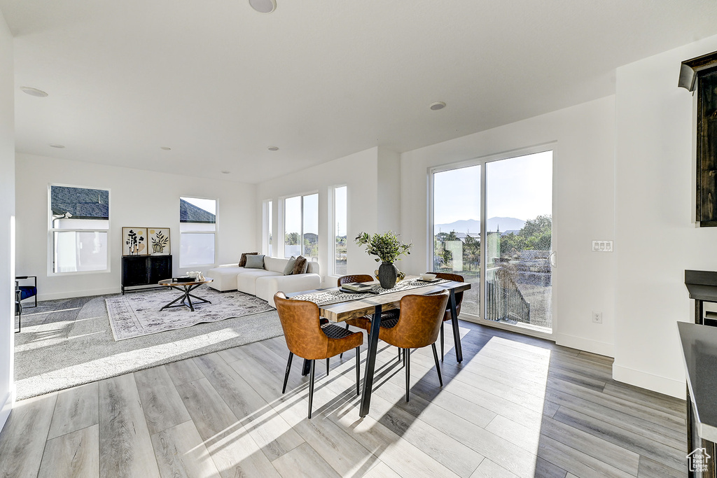 Dining space with light wood-type flooring