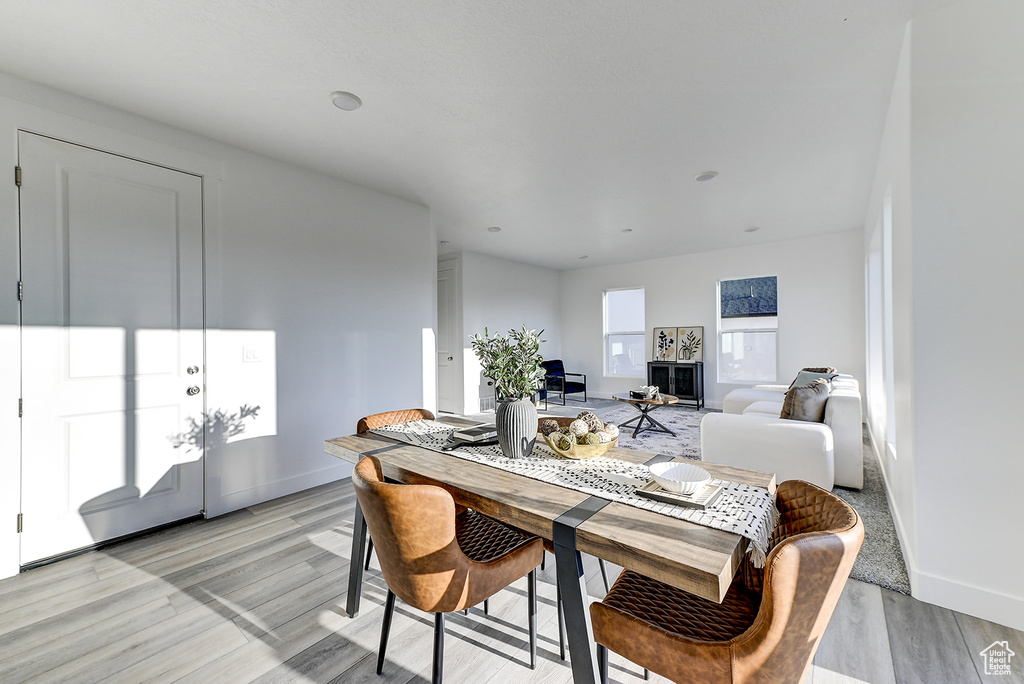 Dining area with light hardwood / wood-style floors