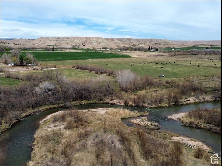 Aerial view featuring a water and mountain view