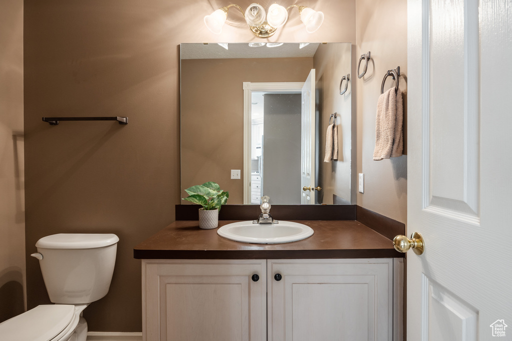 Bathroom with toilet and vanity