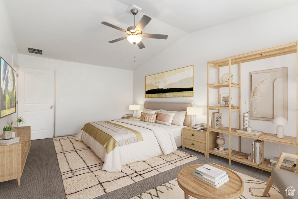 Carpeted bedroom with lofted ceiling and ceiling fan