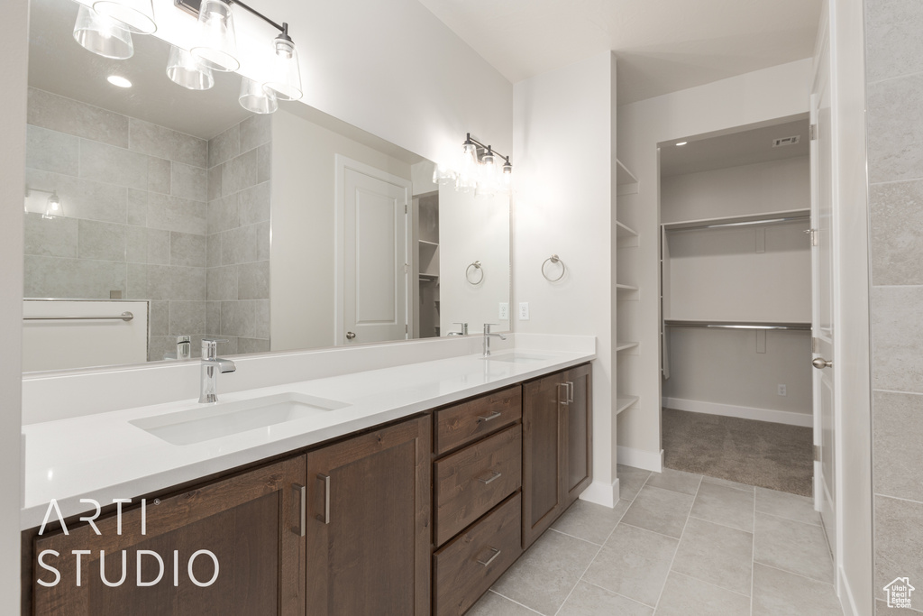 Bathroom with double sink vanity and tile floors