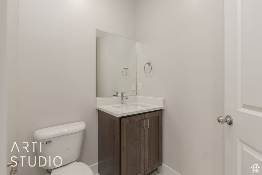 Bathroom with oversized vanity and toilet