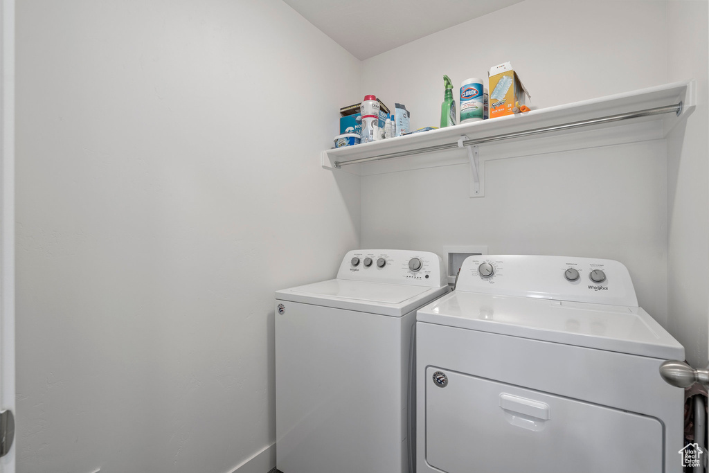 Laundry room featuring washing machine and dryer and washer hookup