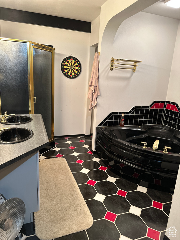 Kitchen featuring dark tile flooring and sink