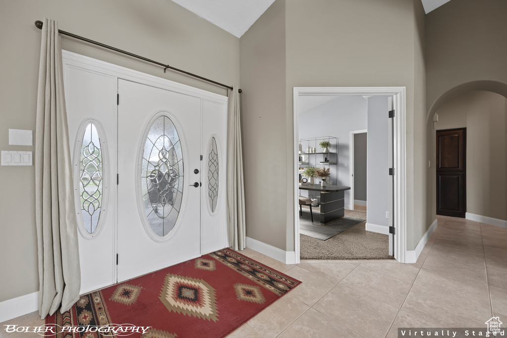 Entryway featuring light tile flooring