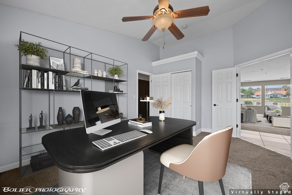 Carpeted home office featuring high vaulted ceiling and ceiling fan