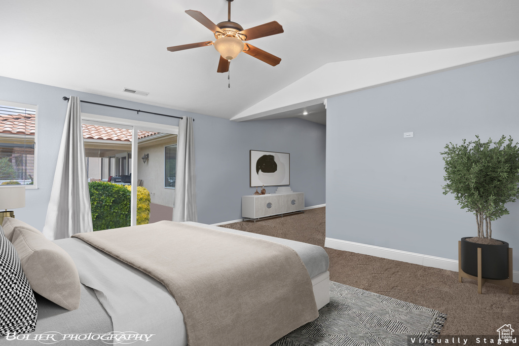 Carpeted bedroom with ceiling fan, access to outside, and vaulted ceiling