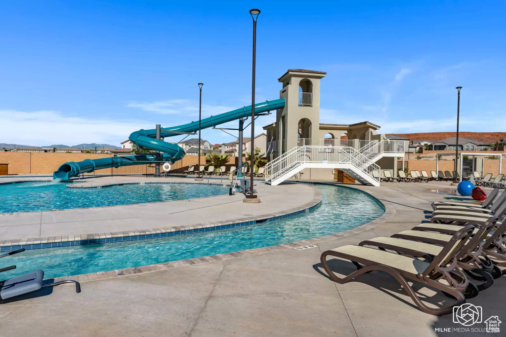 View of pool featuring a patio and a water slide
