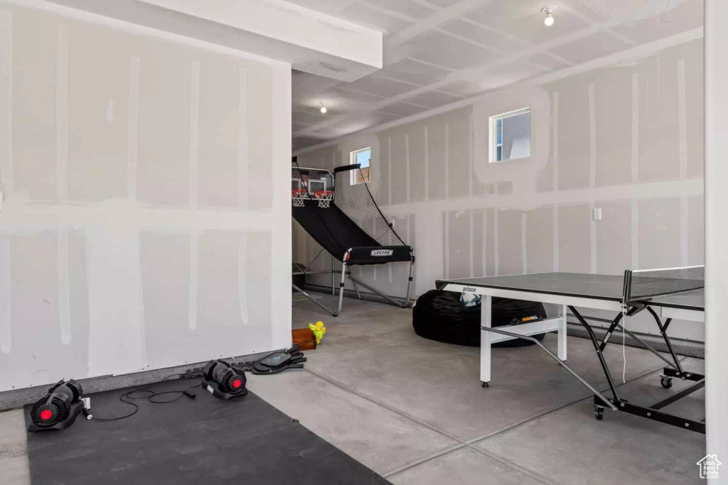 Exercise room with concrete flooring