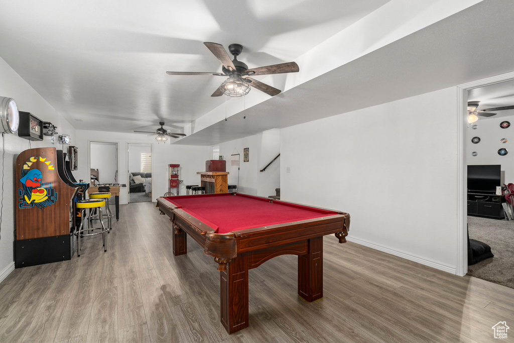 Game room featuring ceiling fan, hardwood / wood-style flooring, and pool table
