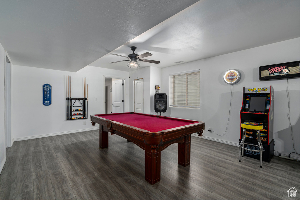 Recreation room featuring dark hardwood / wood-style floors, billiards, and ceiling fan
