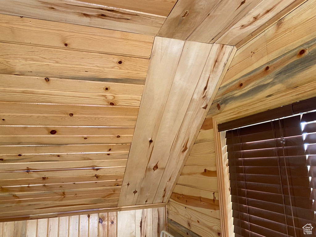 View of sauna featuring wood ceiling and wood walls