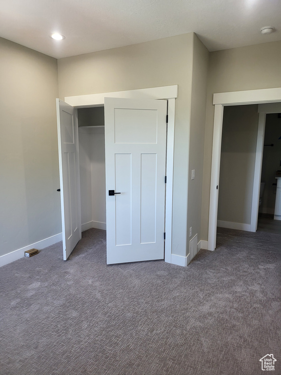 Unfurnished bedroom with carpet floors