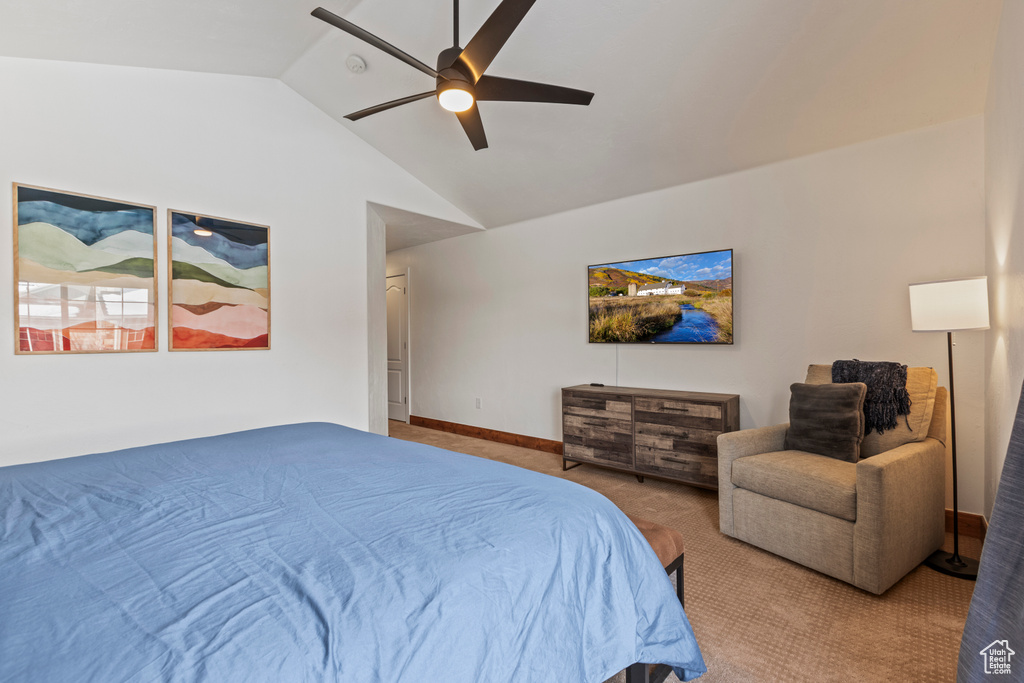 Bedroom featuring lofted ceiling, ceiling fan, and carpet flooring