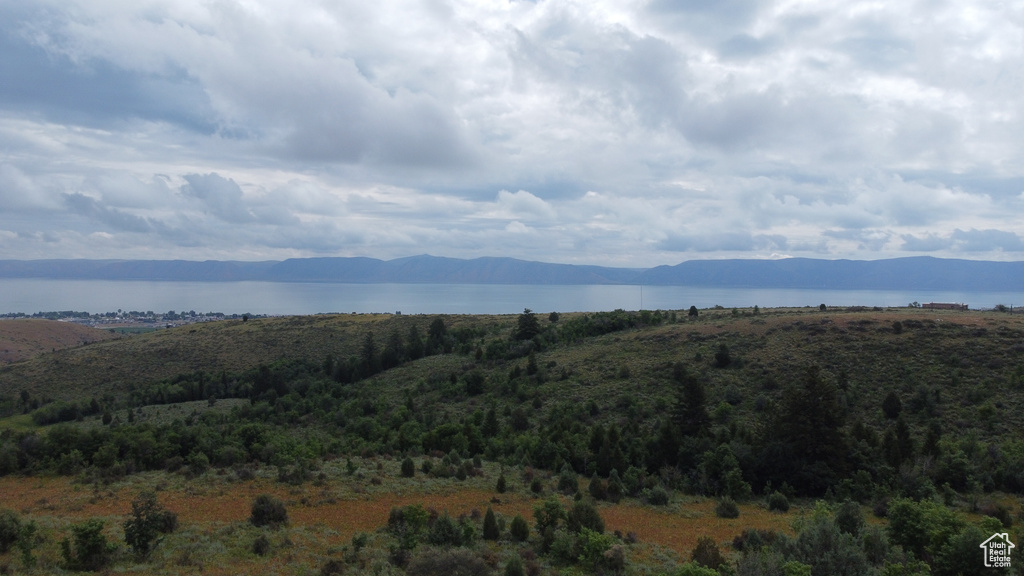 Property view of mountains with a water view