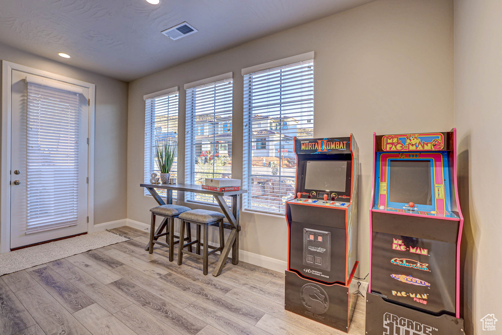 Game room featuring light hardwood / wood-style floors
