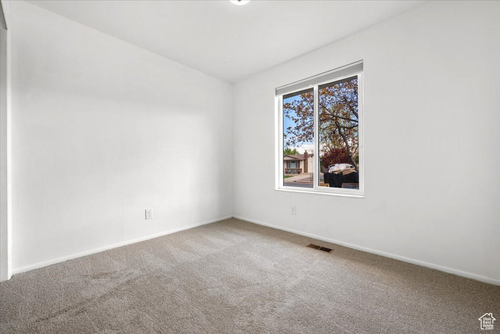 Unfurnished room with carpet floors