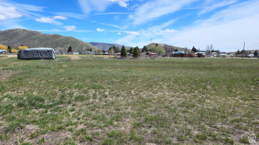 View of yard featuring a mountain view and a rural view