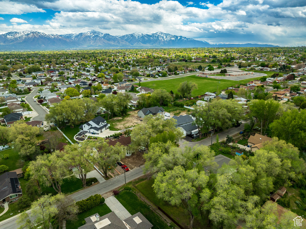 Birds eye view of property with a mountain view