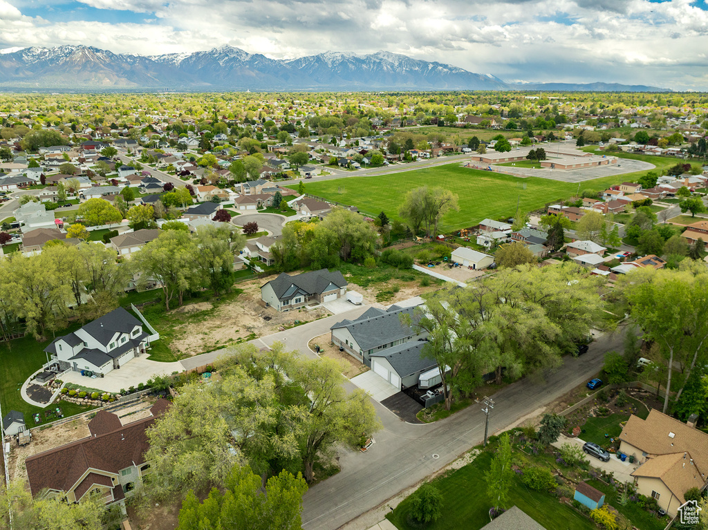 Birds eye view of property with a mountain view