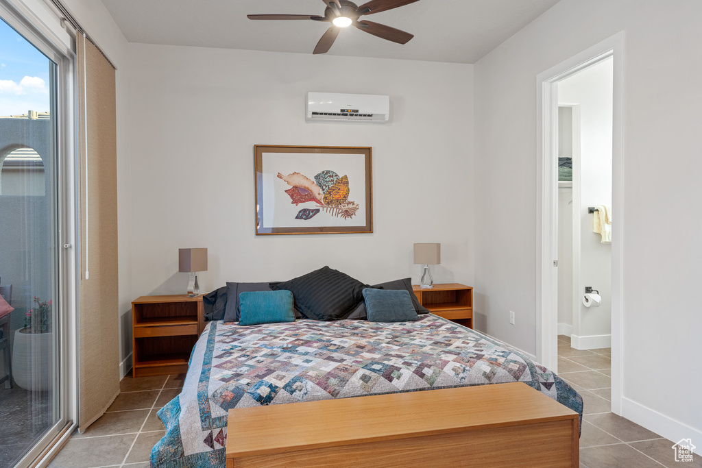 Tiled bedroom with ceiling fan, a wall unit AC, and access to outside