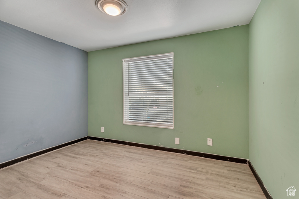 Unfurnished room featuring hardwood / wood-style flooring