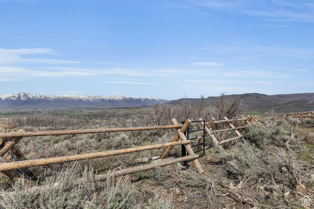 Property view of mountains with a rural view