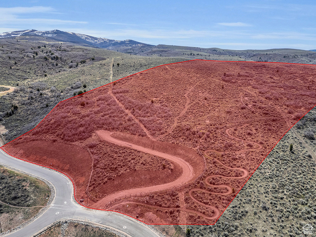 Birds eye view of property with a mountain view