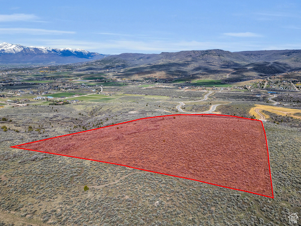 Birds eye view of property featuring a mountain view