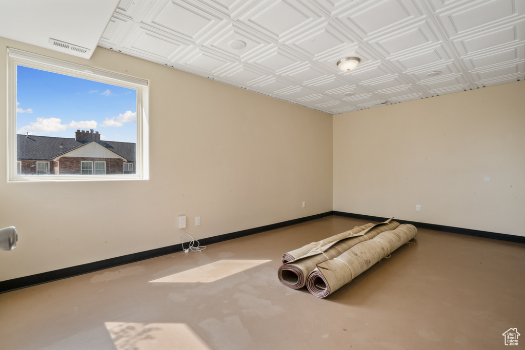 Spare room featuring concrete flooring