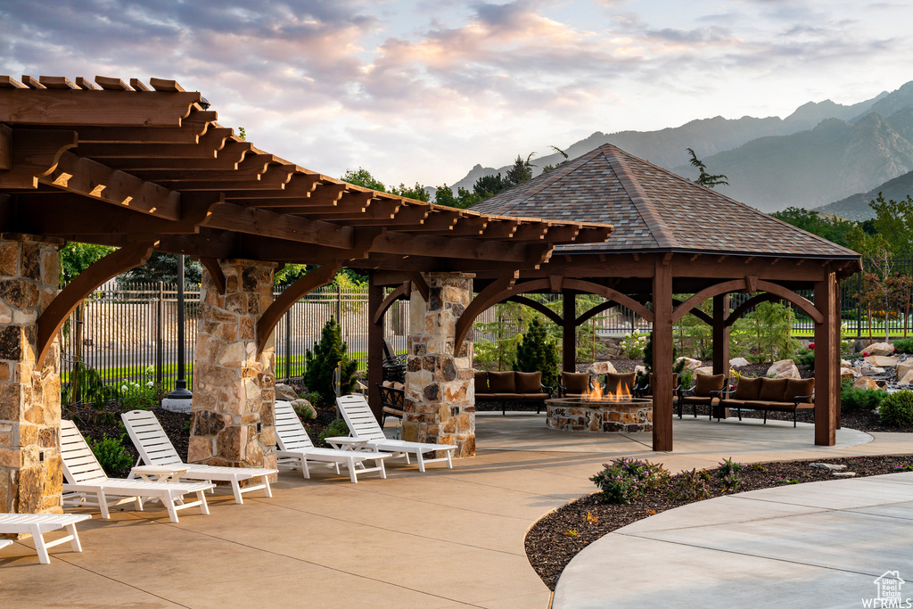 View of nearby features with a patio, a mountain view, a pergola, and a gazebo