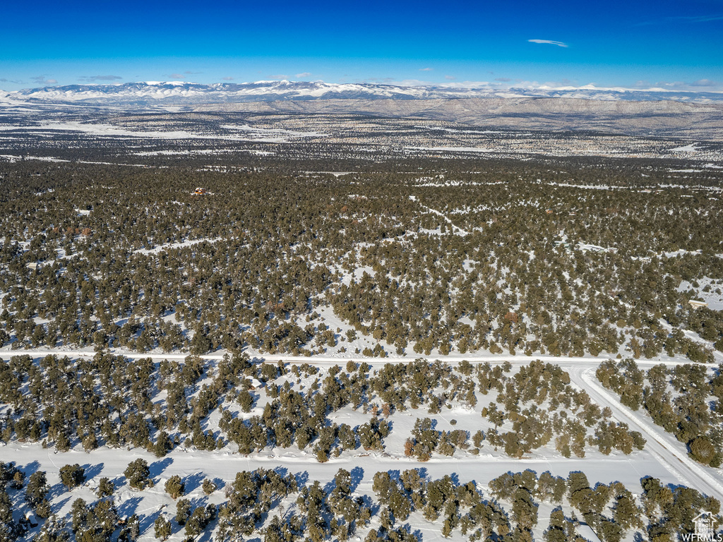 Snowy aerial view with a mountain view